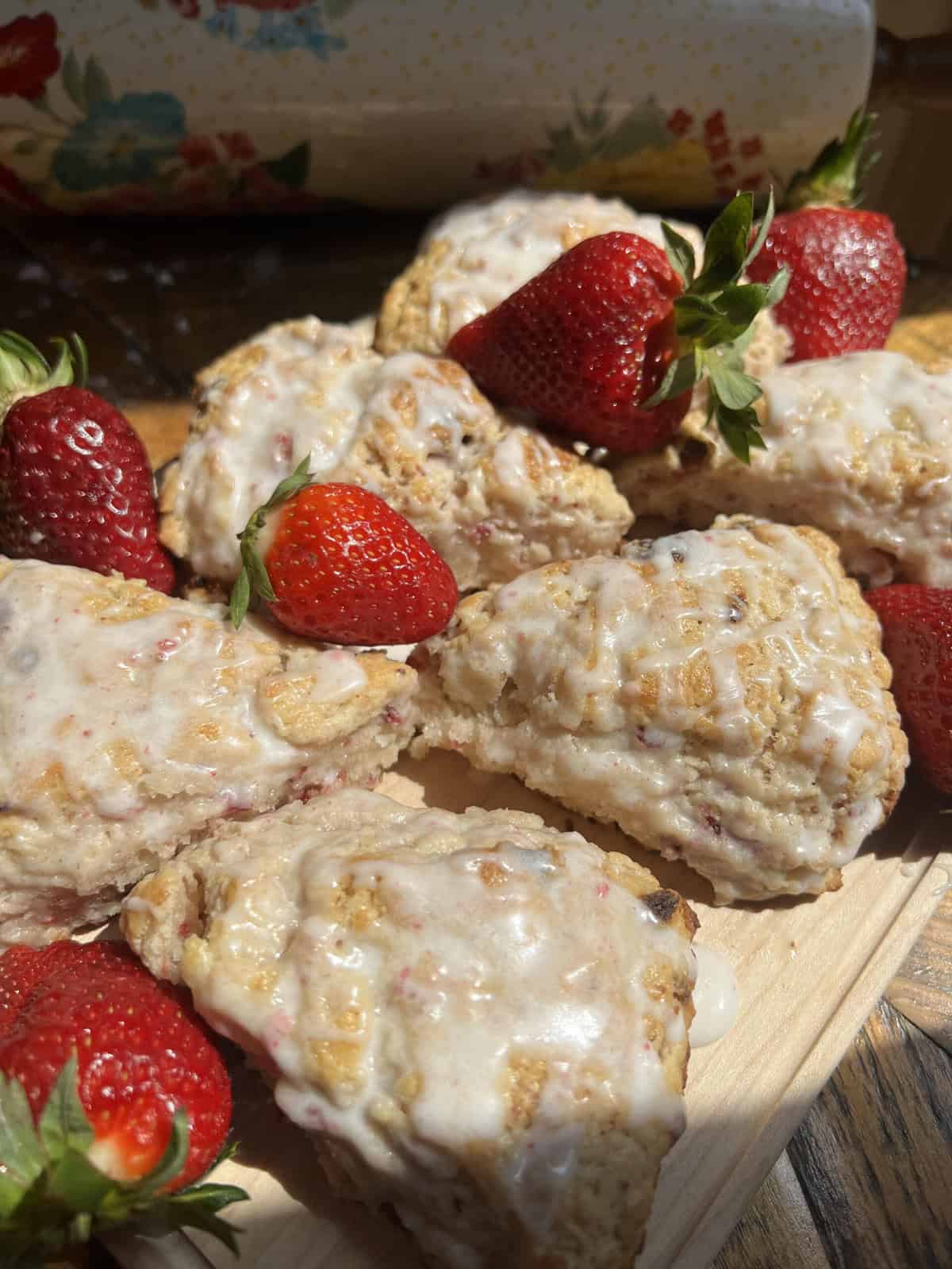 Strawberry scones displayed with fresh strawberries