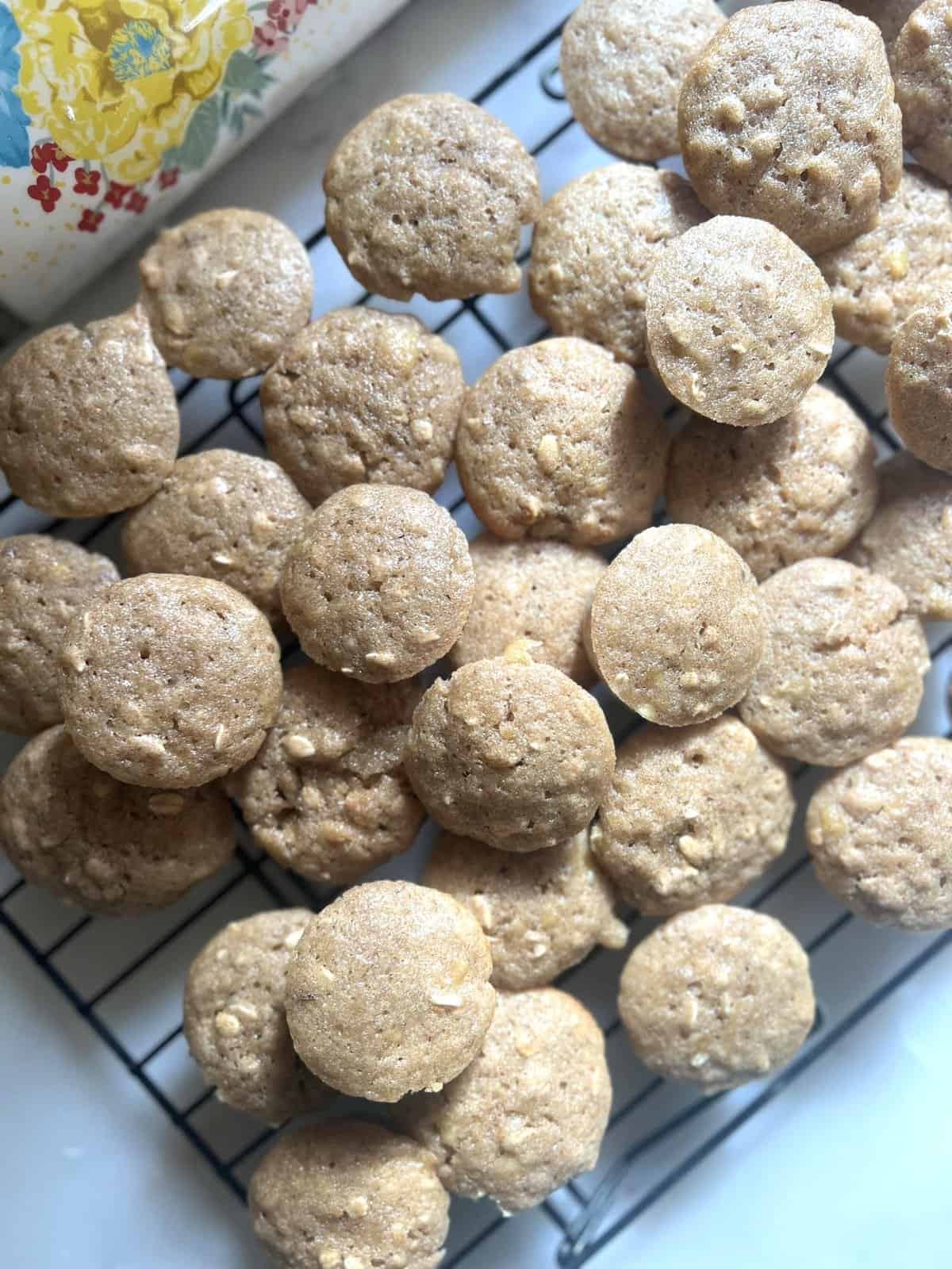 Banana Oat Muffins stacked on a cooling rack